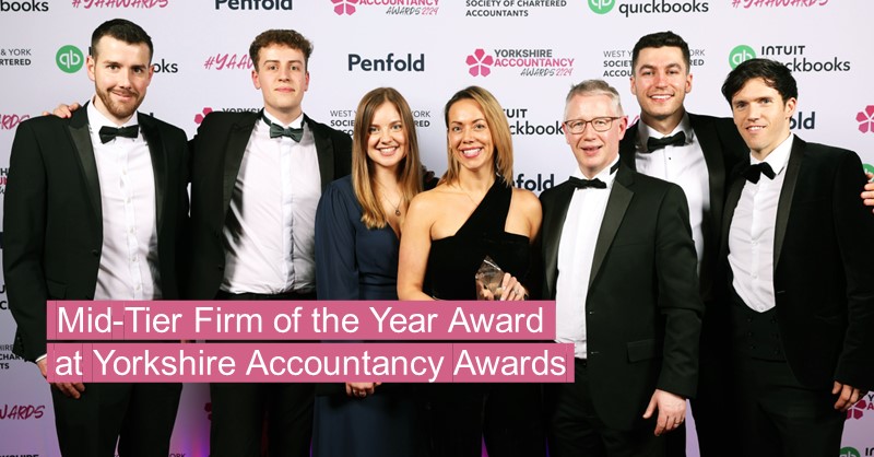 Professional team of accountants winning an industry award.